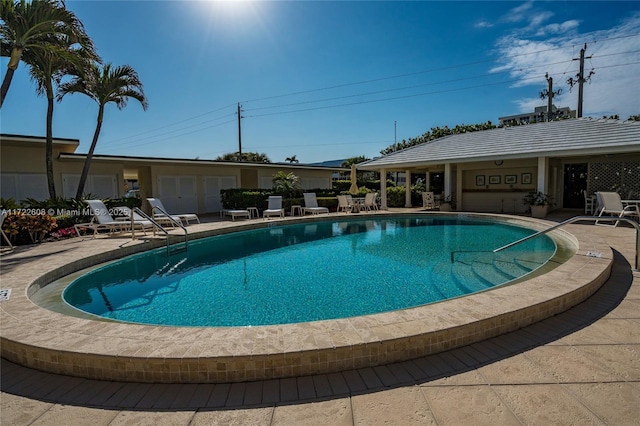 view of swimming pool with a patio area