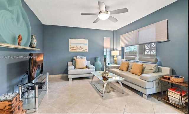 tiled living room with ceiling fan