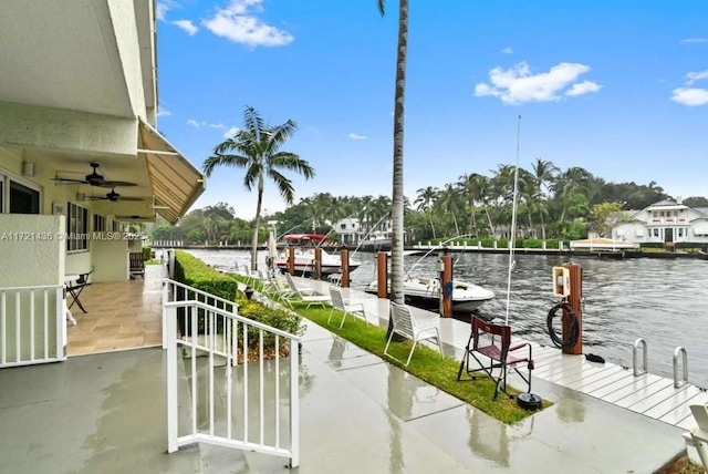 exterior space with a dock and a water view