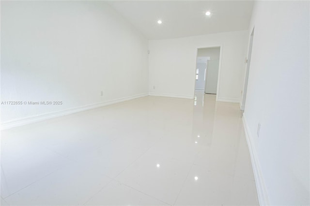 spare room featuring light tile patterned floors