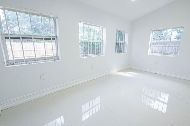 empty room with lofted ceiling