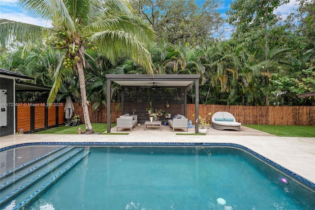 view of pool featuring a patio and ceiling fan