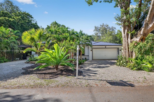1511 SW 30th Pl, Fort Lauderdale, FL 33315 - view of front facade with stucco siding, driveway, and a garage