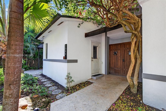 1511 SW 30th Pl, Fort Lauderdale, FL 33315 - doorway to property with stucco siding