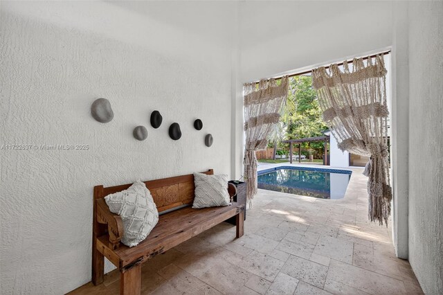 1511 SW 30th Pl, Fort Lauderdale, FL 33315 - sitting room featuring a textured wall and stone tile floors