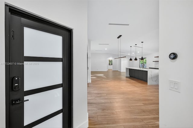 1511 SW 30th Pl, Fort Lauderdale, FL 33315 - hallway featuring light wood-type flooring and recessed lighting