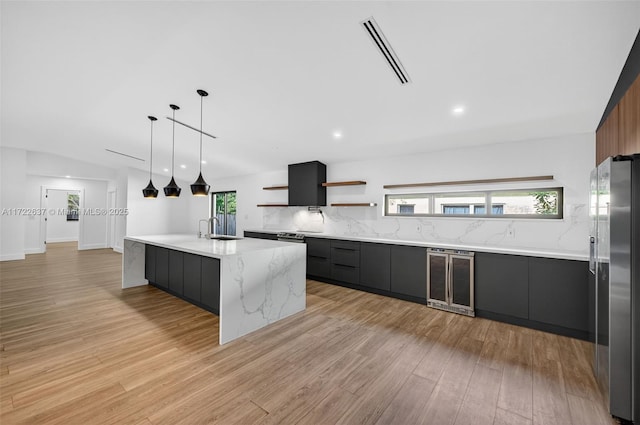 1511 SW 30th Pl, Fort Lauderdale, FL 33315 - kitchen with beverage cooler, stainless steel fridge with ice dispenser, modern cabinets, open shelves, and light wood finished floors