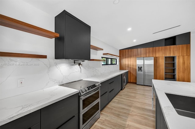 1511 SW 30th Pl, Fort Lauderdale, FL 33315 - kitchen with open shelves, appliances with stainless steel finishes, modern cabinets, dark cabinetry, and lofted ceiling