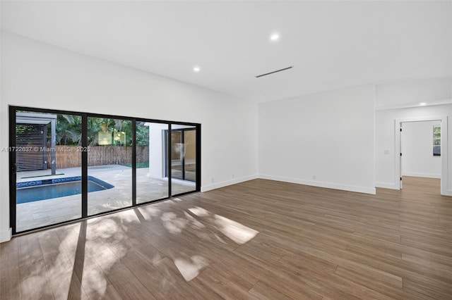 1511 SW 30th Pl, Fort Lauderdale, FL 33315 - spare room with wood finished floors and recessed lighting
