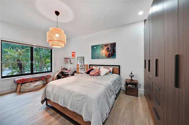 bedroom with light hardwood / wood-style floors