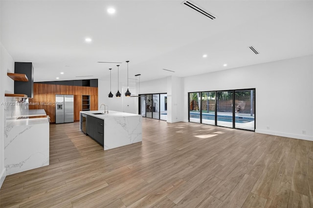 1511 SW 30th Pl, Fort Lauderdale, FL 33315 - kitchen with modern cabinets, stainless steel refrigerator with ice dispenser, open shelves, open floor plan, and recessed lighting