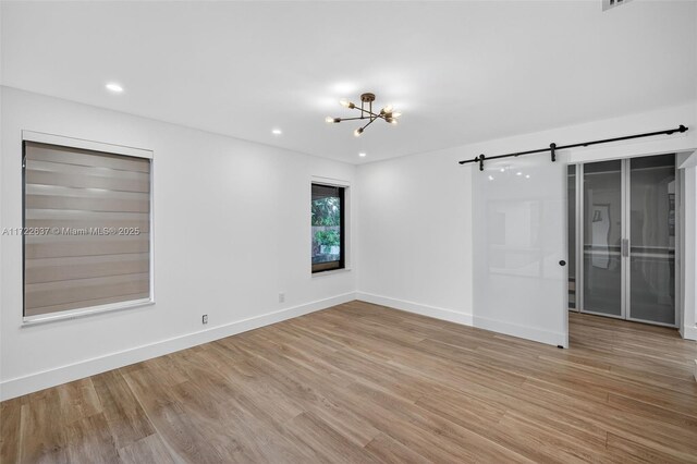 1511 SW 30th Pl, Fort Lauderdale, FL 33315 - spare room featuring a chandelier, light wood-type flooring, and recessed lighting