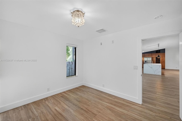 1511 SW 30th Pl, Fort Lauderdale, FL 33315 - unfurnished room with wood finished floors and baseboards