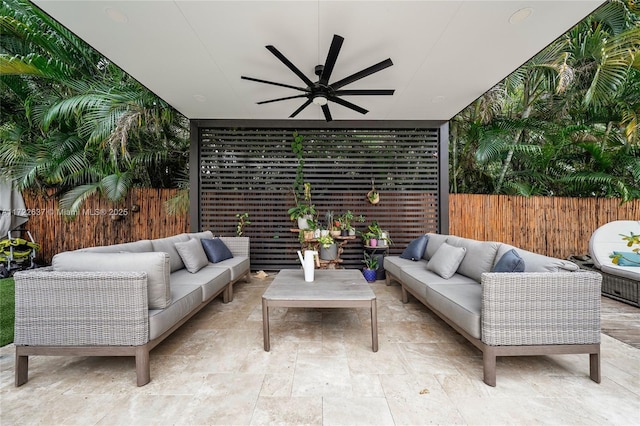 view of patio / terrace with an outdoor living space and ceiling fan