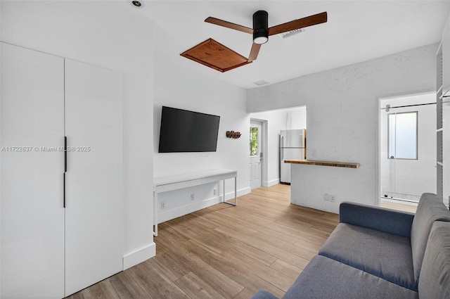 1511 SW 30th Pl, Fort Lauderdale, FL 33315 - living area with a ceiling fan and light wood-style flooring