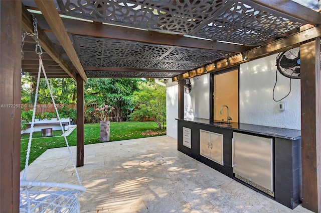 1511 SW 30th Pl, Fort Lauderdale, FL 33315 - view of patio featuring exterior kitchen and a pergola