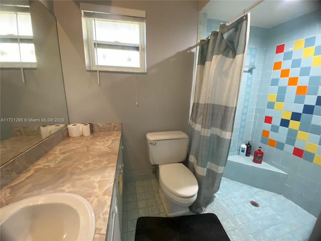 bathroom with tile patterned floors, vanity, and toilet