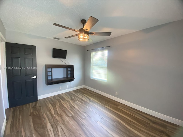 unfurnished living room with hardwood / wood-style floors and ceiling fan