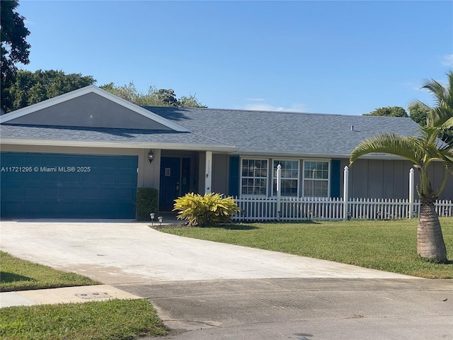 ranch-style home with a front lawn and a garage