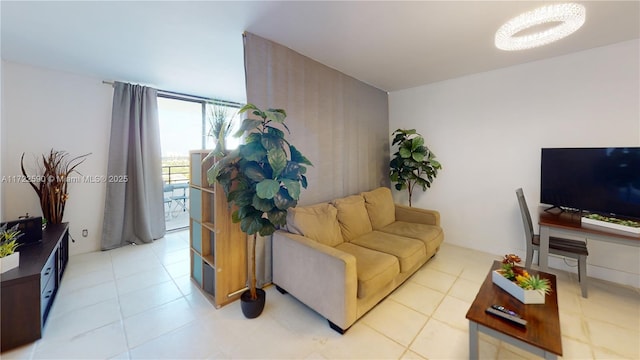 living room featuring floor to ceiling windows