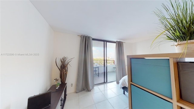 bedroom with access to outside and floor to ceiling windows