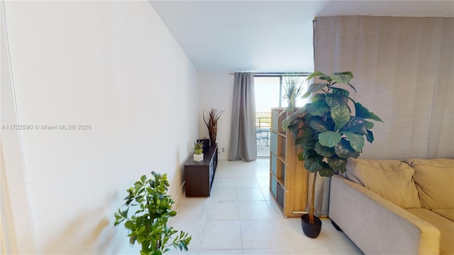 corridor featuring light tile patterned floors and floor to ceiling windows