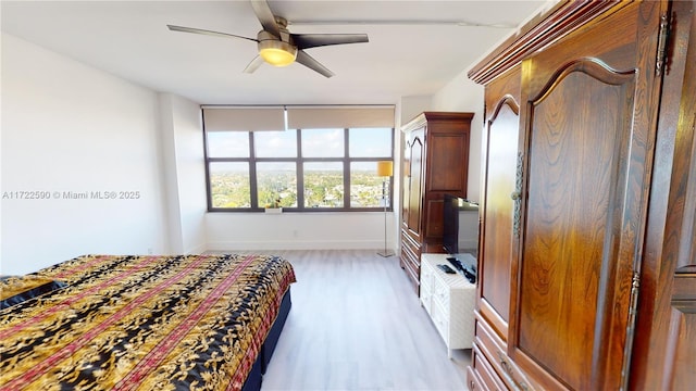 unfurnished bedroom featuring ceiling fan and light hardwood / wood-style flooring