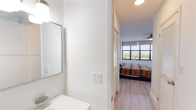 bathroom featuring wood-type flooring and ceiling fan