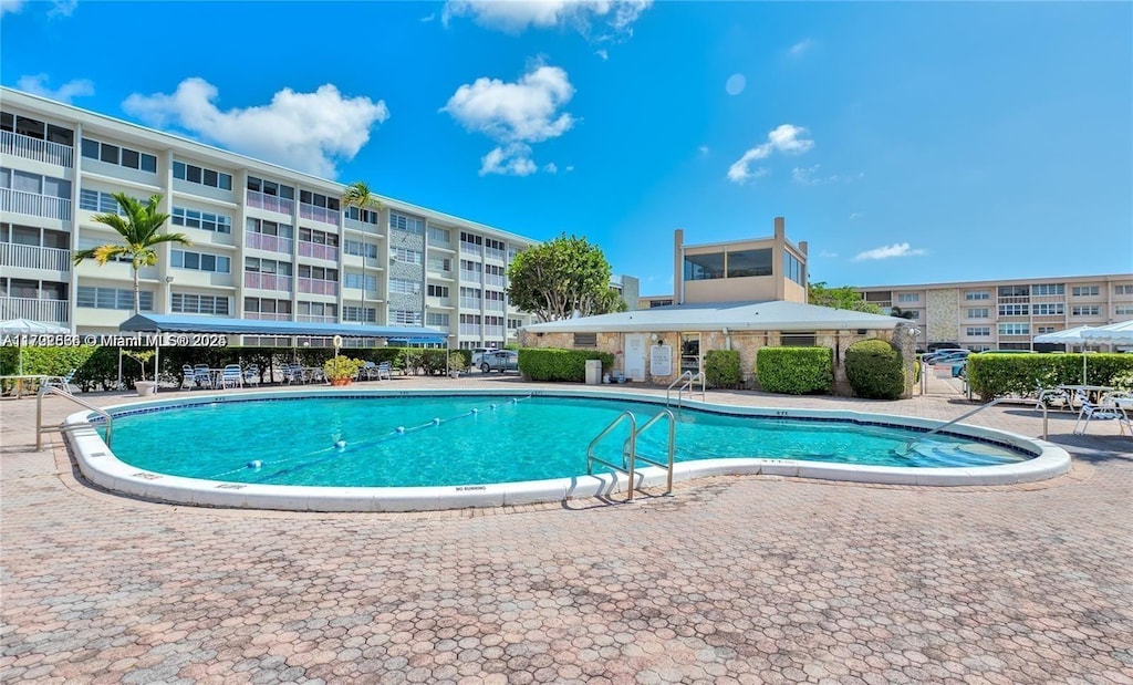 view of swimming pool featuring a patio