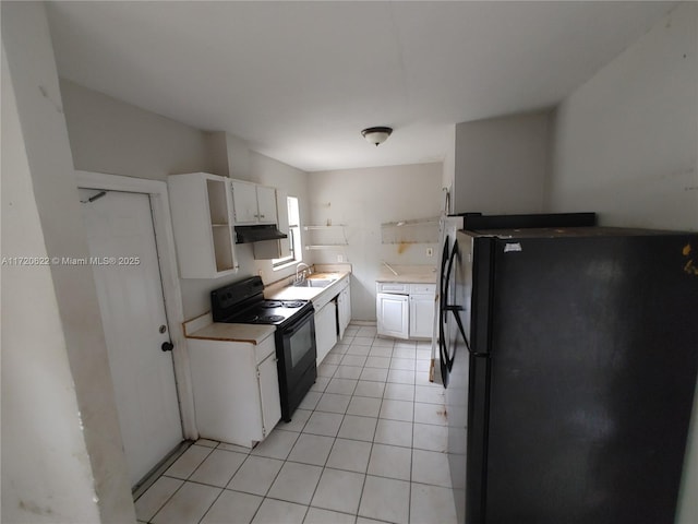 kitchen with white cabinets, sink, light tile patterned floors, and black appliances