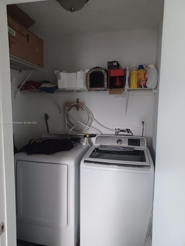 laundry room featuring washing machine and dryer