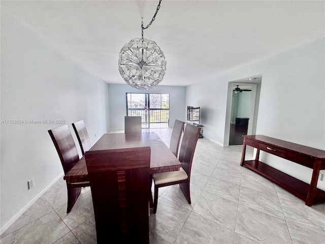 dining area with ceiling fan with notable chandelier