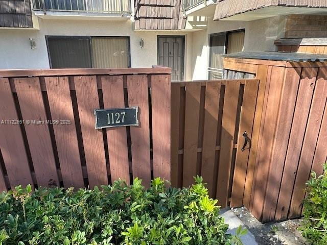 view of gate featuring fence