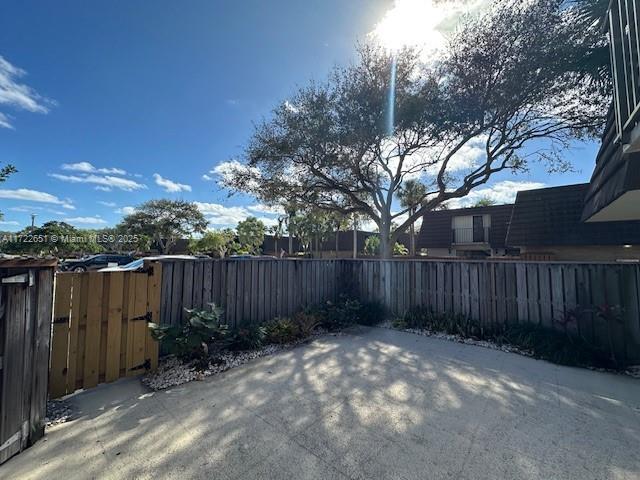 view of patio / terrace featuring a gate and fence