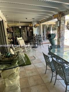 view of patio / terrace featuring an outdoor bar