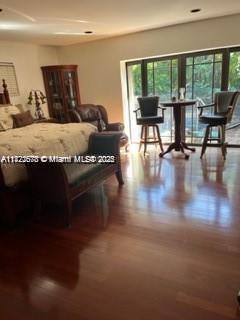 bedroom with hardwood / wood-style floors