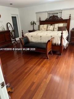 bedroom with hardwood / wood-style floors