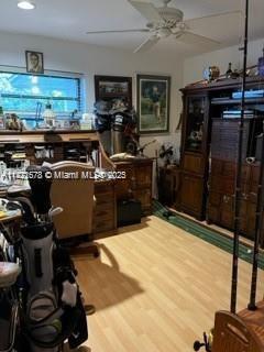 office with hardwood / wood-style flooring and ceiling fan