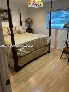 bedroom with hardwood / wood-style flooring