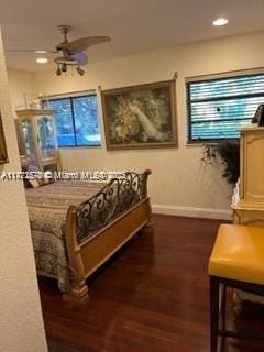 bedroom with dark wood-type flooring and ceiling fan