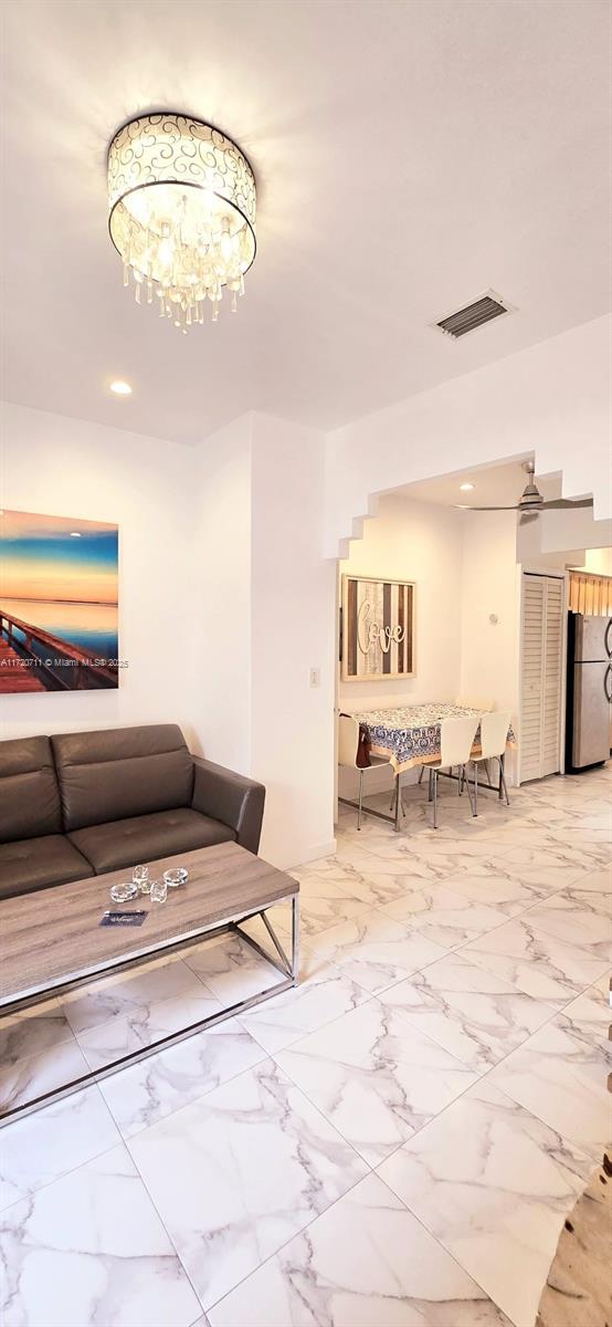 living room featuring an inviting chandelier