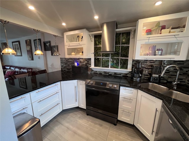 kitchen featuring white cabinets, ventilation hood, hanging light fixtures, and electric stove