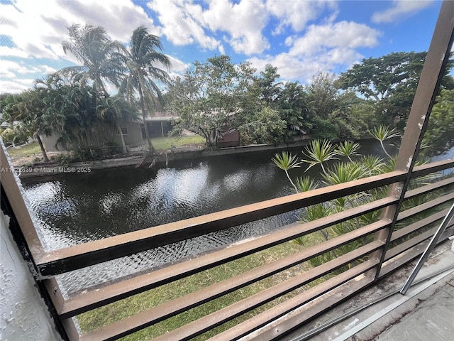 balcony featuring a water view