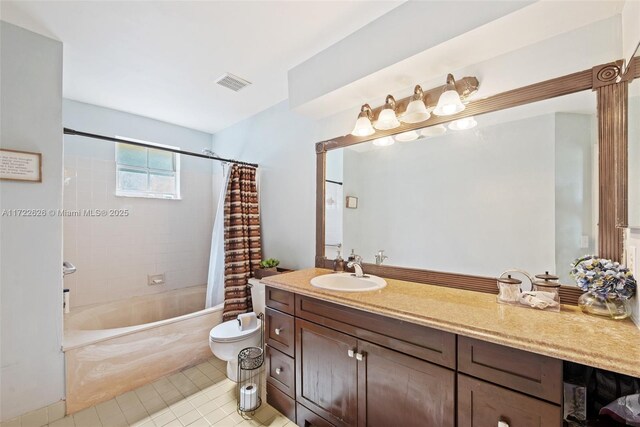 full bathroom featuring toilet, tile patterned floors, shower / tub combo with curtain, and vanity