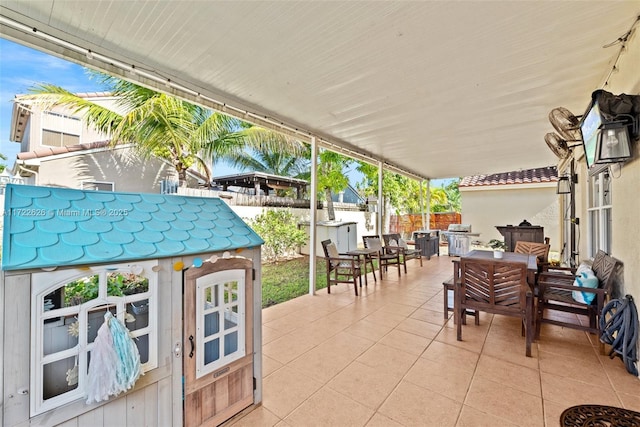 view of patio featuring an outbuilding