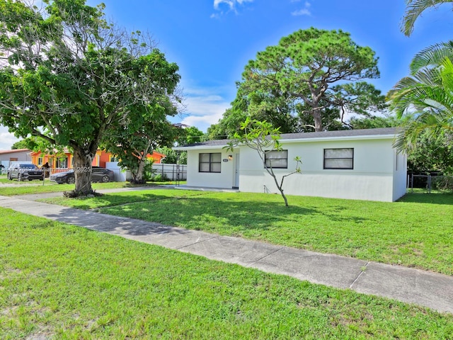 single story home with a front yard