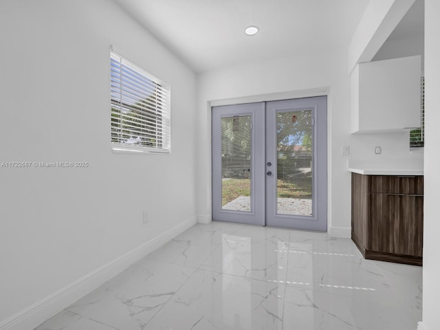 interior space featuring a wealth of natural light and french doors