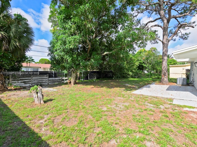 view of yard with a patio and central AC unit