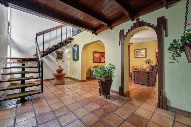 entryway with beam ceiling and wooden ceiling