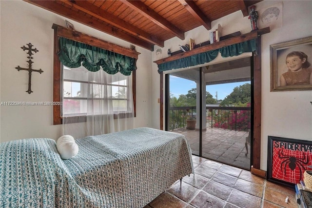 bedroom featuring beam ceiling, access to exterior, and wooden ceiling